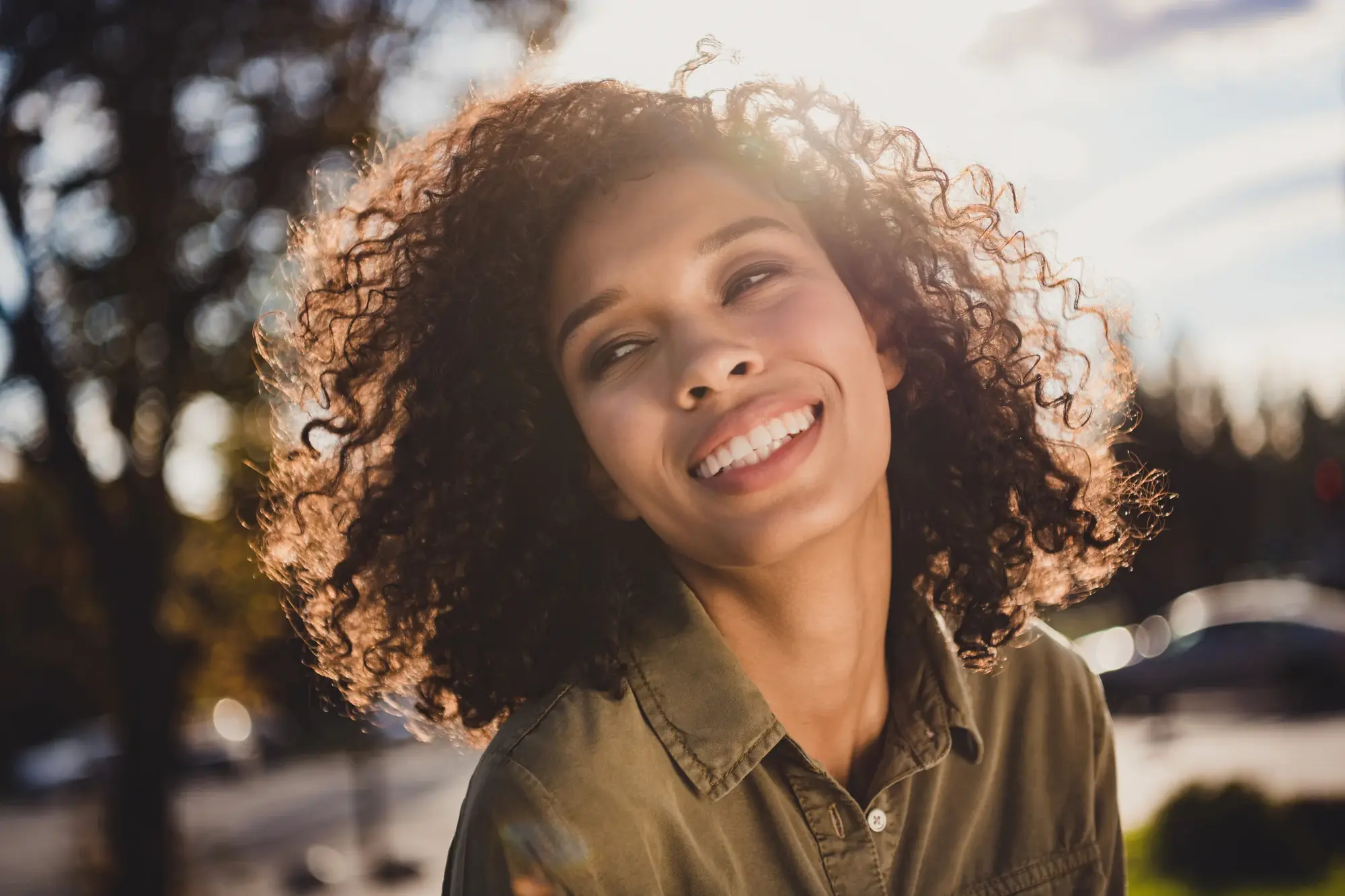 A patient smiling outdoors